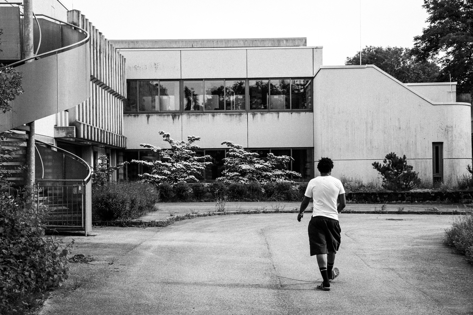 Walking away — the courtyard, empty and full at once.
