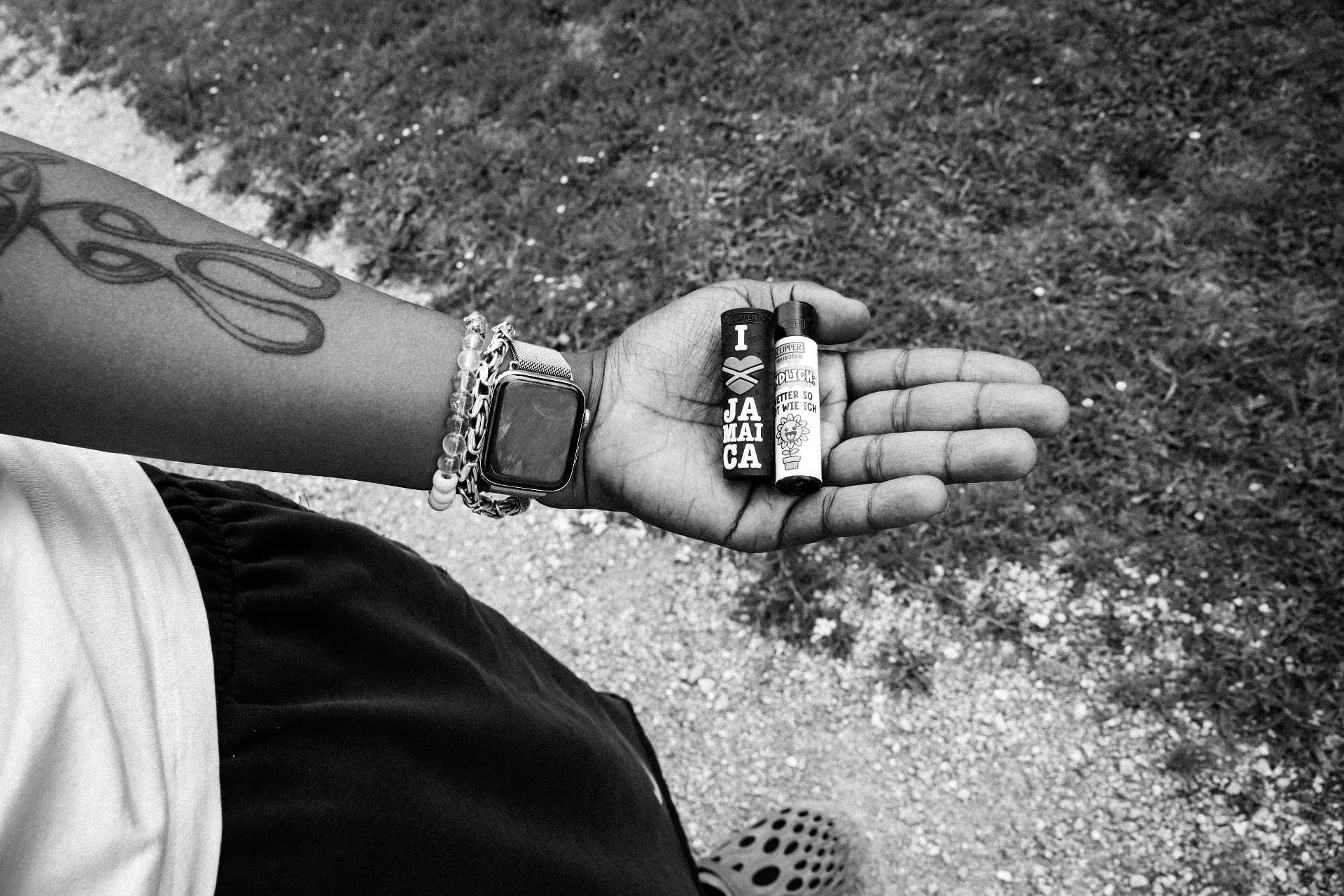 In the palm of the hand — two lighters, a watch, an afternoon.