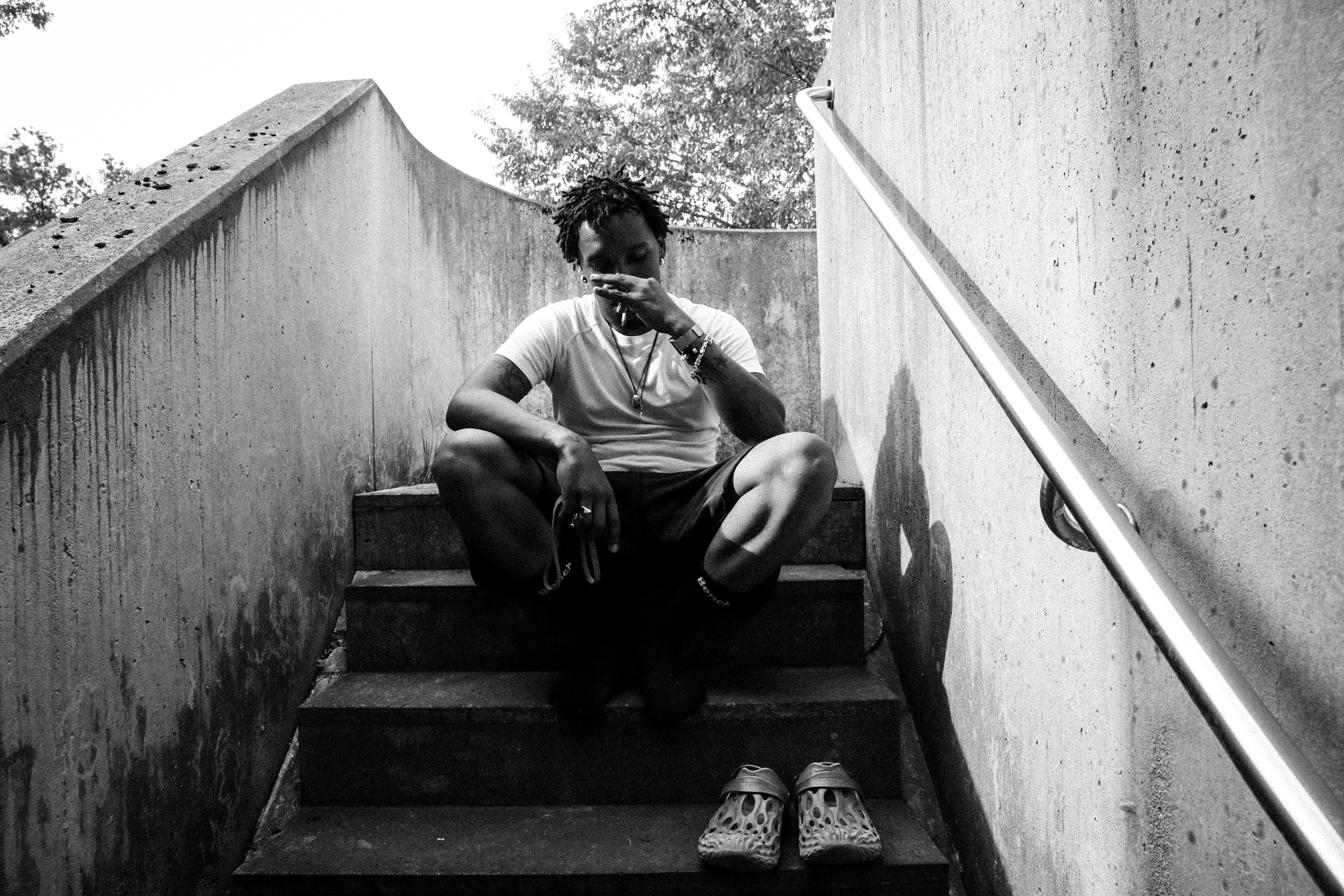 On the stairs — a pause between conversations.